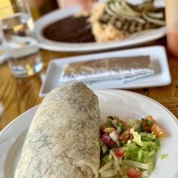 De Mole signature dishes Pollo BurritoGuacamole and ChipsGrilled Steak SincronizadaFresh Corn Tamales